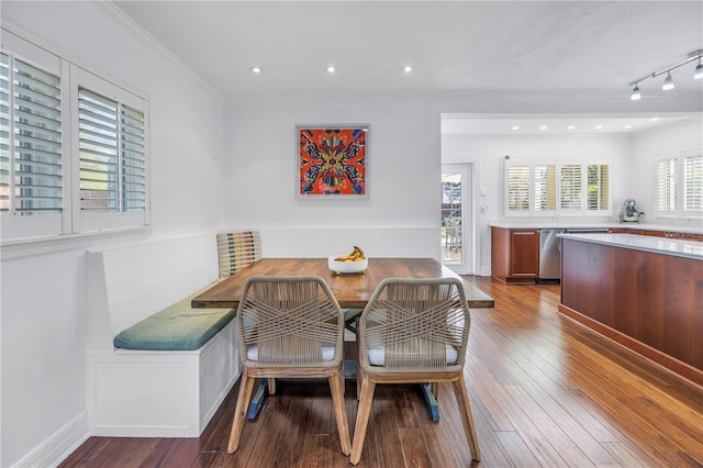 dining area with breakfast area, recessed lighting, dark wood-style flooring, and crown molding