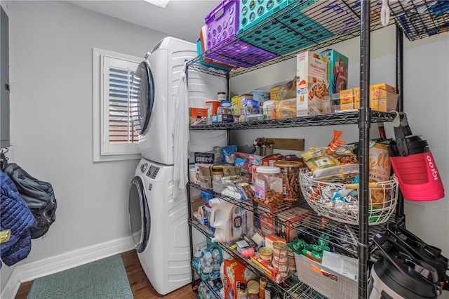 interior space featuring stacked washing maching and dryer