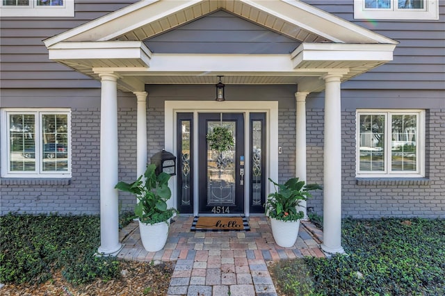 entrance to property with a porch