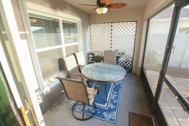 sunroom featuring ceiling fan