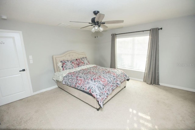 bedroom featuring carpet floors, baseboards, and visible vents