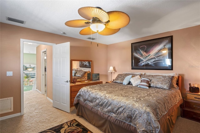 bedroom with light carpet, baseboards, visible vents, and ceiling fan