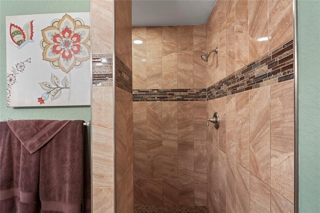 bathroom with tiled shower