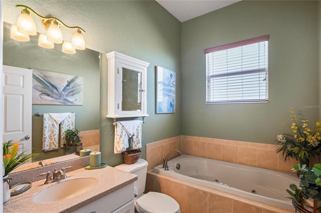 full bath with a whirlpool tub, toilet, and vanity