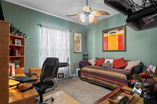 bedroom featuring carpet, a textured wall, and ceiling fan