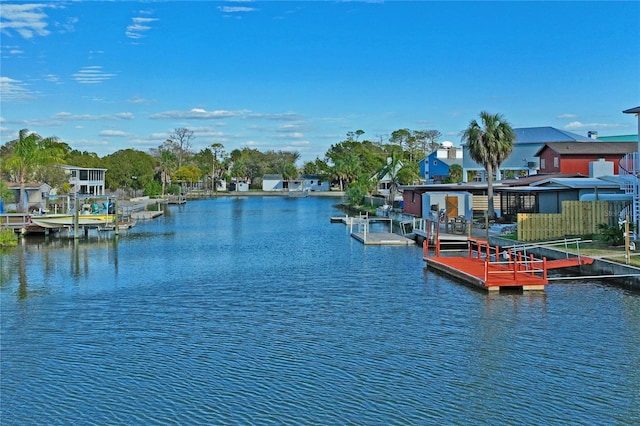 dock area featuring a water view and a residential view