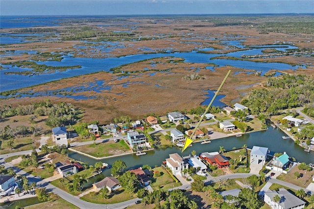 aerial view featuring a water view and a residential view