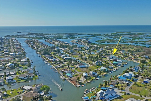 drone / aerial view featuring a water view and a residential view