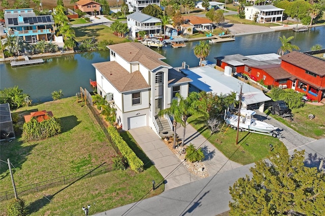 bird's eye view with a water view and a residential view