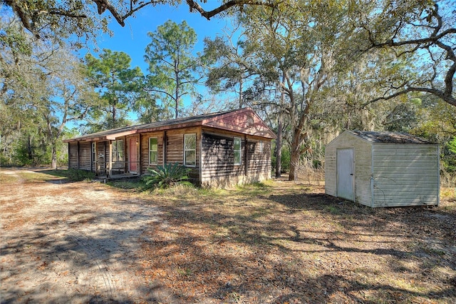 view of shed featuring covered porch