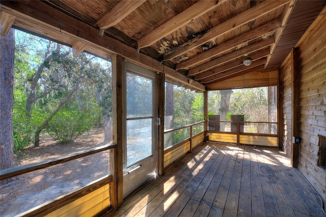 unfurnished sunroom with lofted ceiling and wooden ceiling