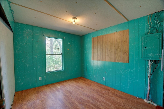 empty room with wood finished floors