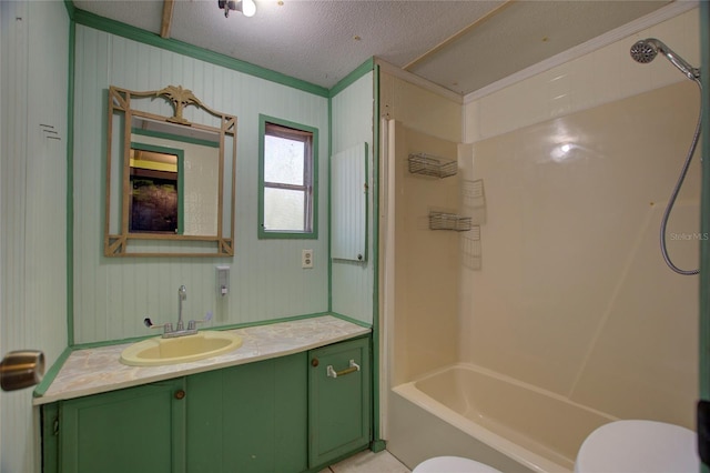 full bath featuring a textured ceiling, shower / tub combination, vanity, and toilet