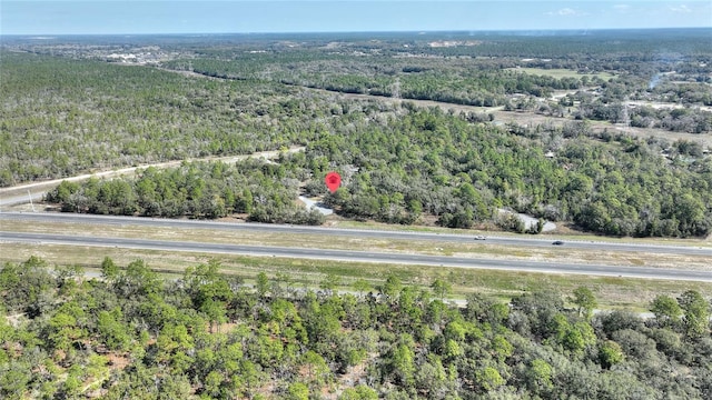 bird's eye view featuring a forest view