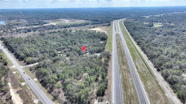 birds eye view of property featuring a rural view