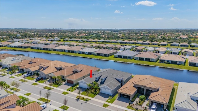 aerial view with a water view and a residential view