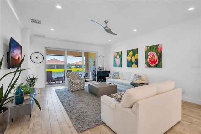 living room with a ceiling fan, light wood-type flooring, visible vents, and recessed lighting