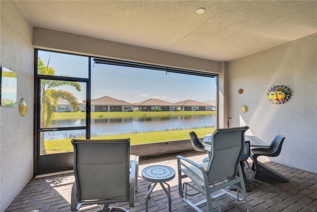 sunroom with a water view