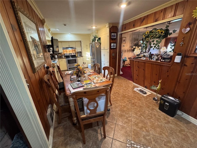 tiled dining room with crown molding