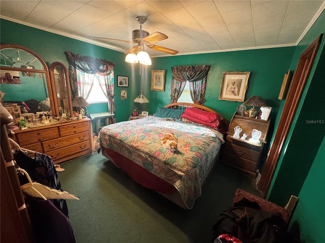 bedroom with ceiling fan, ornamental molding, and carpet