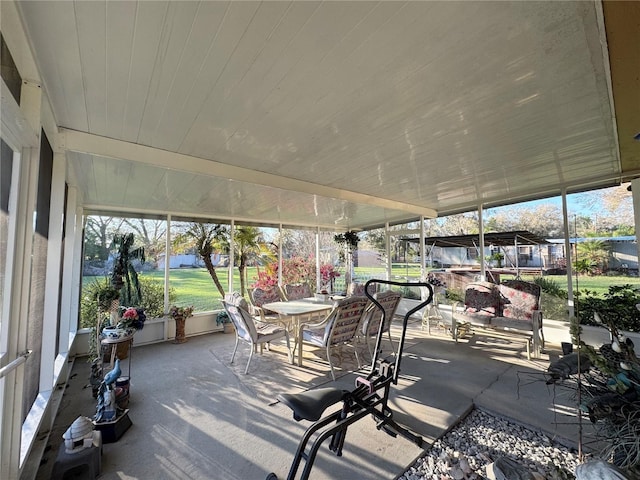 sunroom / solarium featuring wooden ceiling