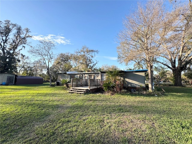 view of yard with a deck