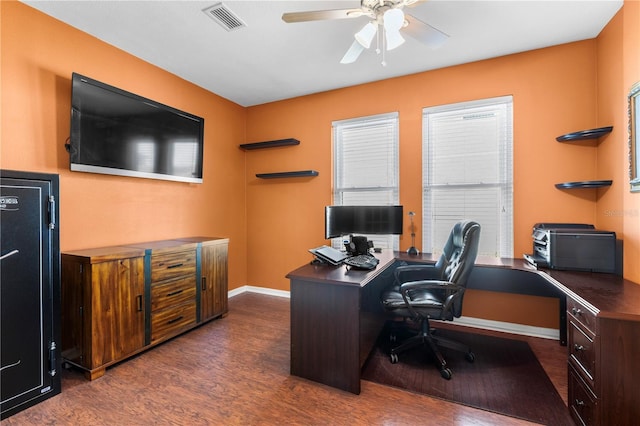 home office with baseboards, wood finished floors, visible vents, and a ceiling fan