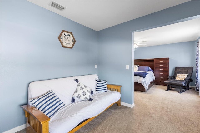 bedroom featuring carpet, visible vents, and baseboards