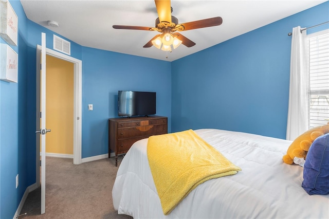 bedroom featuring a ceiling fan, carpet, visible vents, and baseboards