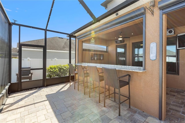 sunroom / solarium with a bar and plenty of natural light