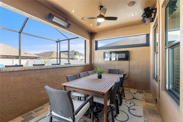 sunroom / solarium with ceiling fan