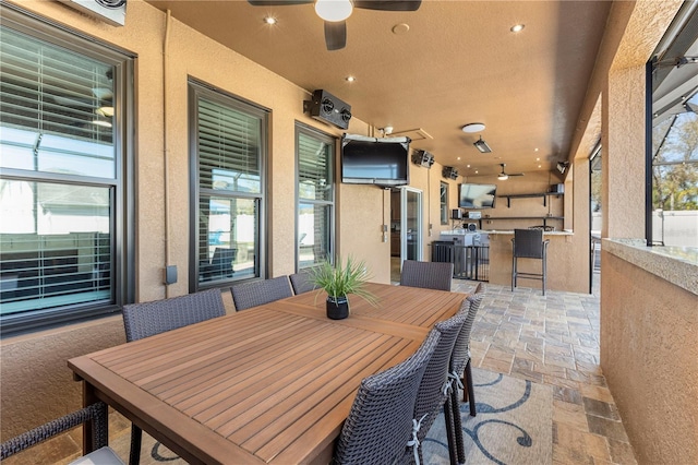 view of patio / terrace featuring ceiling fan, outdoor dining area, and area for grilling