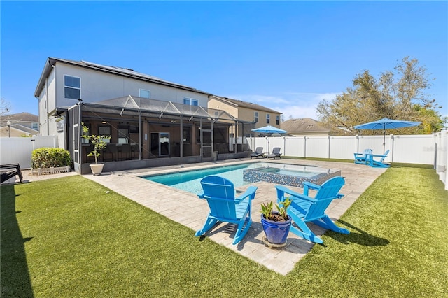 view of swimming pool with a fenced in pool, a yard, a patio area, a lanai, and a fenced backyard