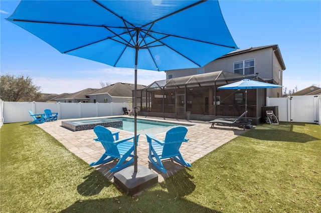 view of pool with a lanai, a patio area, a fenced backyard, and a yard