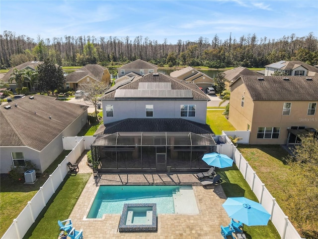 exterior space with a yard, a fenced backyard, central AC, and a patio