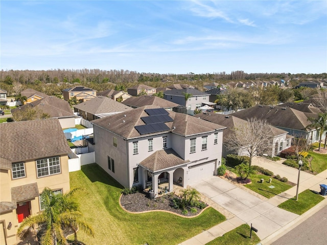 birds eye view of property with a residential view