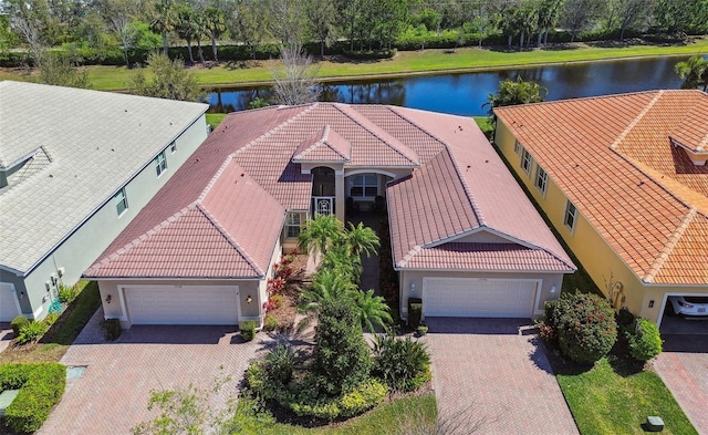 birds eye view of property with a water view