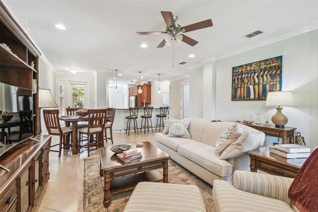 living area with visible vents, ceiling fan, light tile patterned flooring, crown molding, and recessed lighting