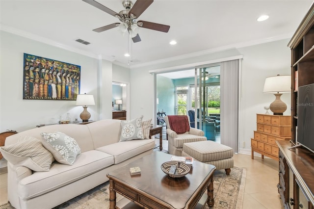 living area with light tile patterned flooring, ceiling fan, ornamental molding, and recessed lighting