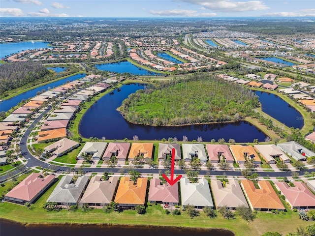 aerial view with a water view and a residential view