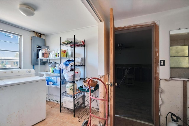 laundry room with light tile patterned floors, laundry area, washer / clothes dryer, and electric panel