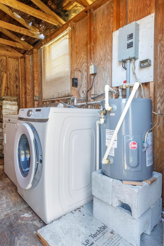 laundry area featuring water heater, laundry area, and washing machine and dryer