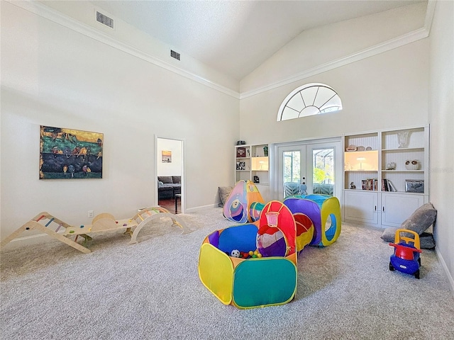 rec room with high vaulted ceiling, carpet, visible vents, and french doors