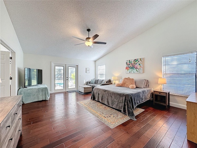 bedroom with a textured ceiling, french doors, dark wood-type flooring, and access to exterior