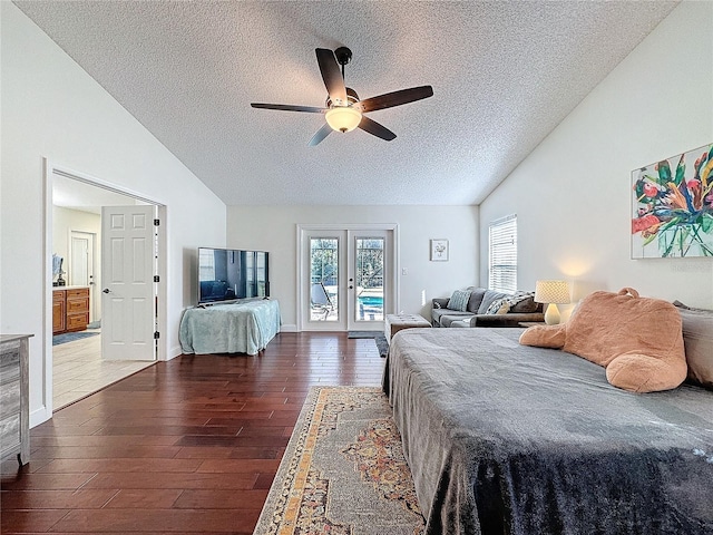 bedroom with access to exterior, multiple windows, wood finished floors, and french doors