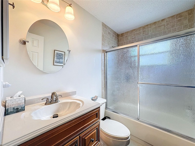 full bathroom with toilet, shower / bath combination with glass door, a textured ceiling, and vanity