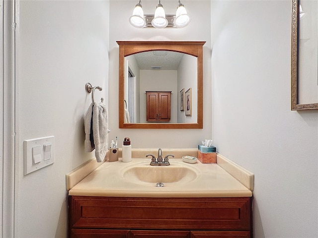 bathroom featuring visible vents and vanity