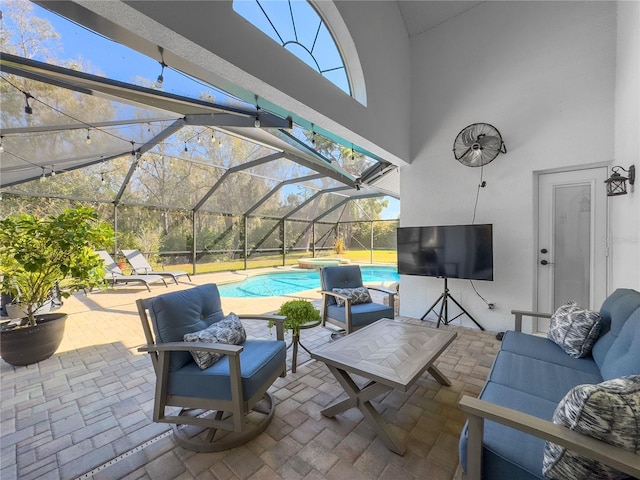 view of patio with an outdoor pool, glass enclosure, and an outdoor hangout area