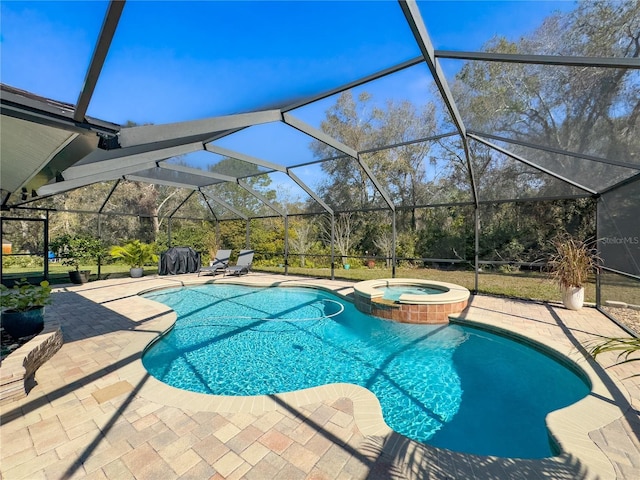 view of pool with glass enclosure, a patio area, and a pool with connected hot tub