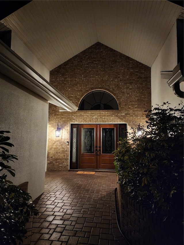 entrance to property with french doors and brick siding